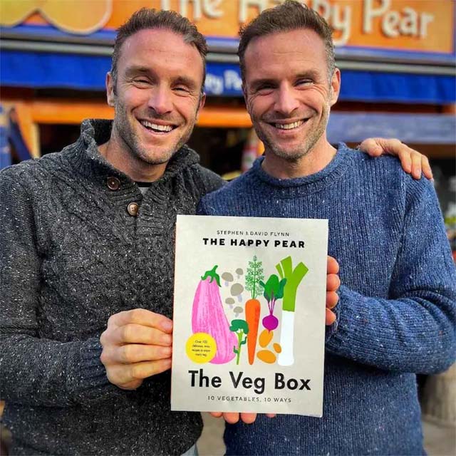 david and stephen flynn holding their book: the veg box