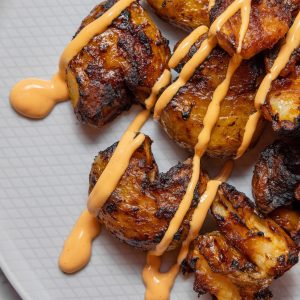 An image of Spicy Smashed potatoes with Sriracha mayo