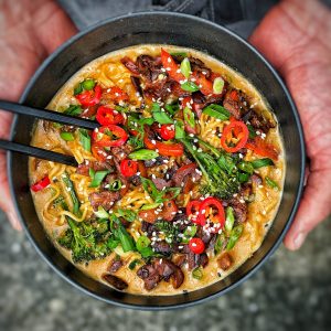 An image of Thai red curry ramen bowl