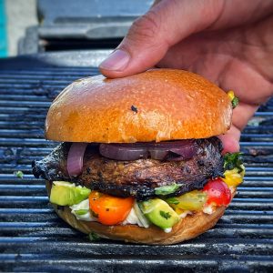 An image of Vegan BBQ 101, charred portobello burgers