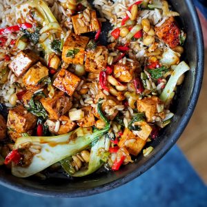 An image of Quick Kung Pao tofu with rice and greens