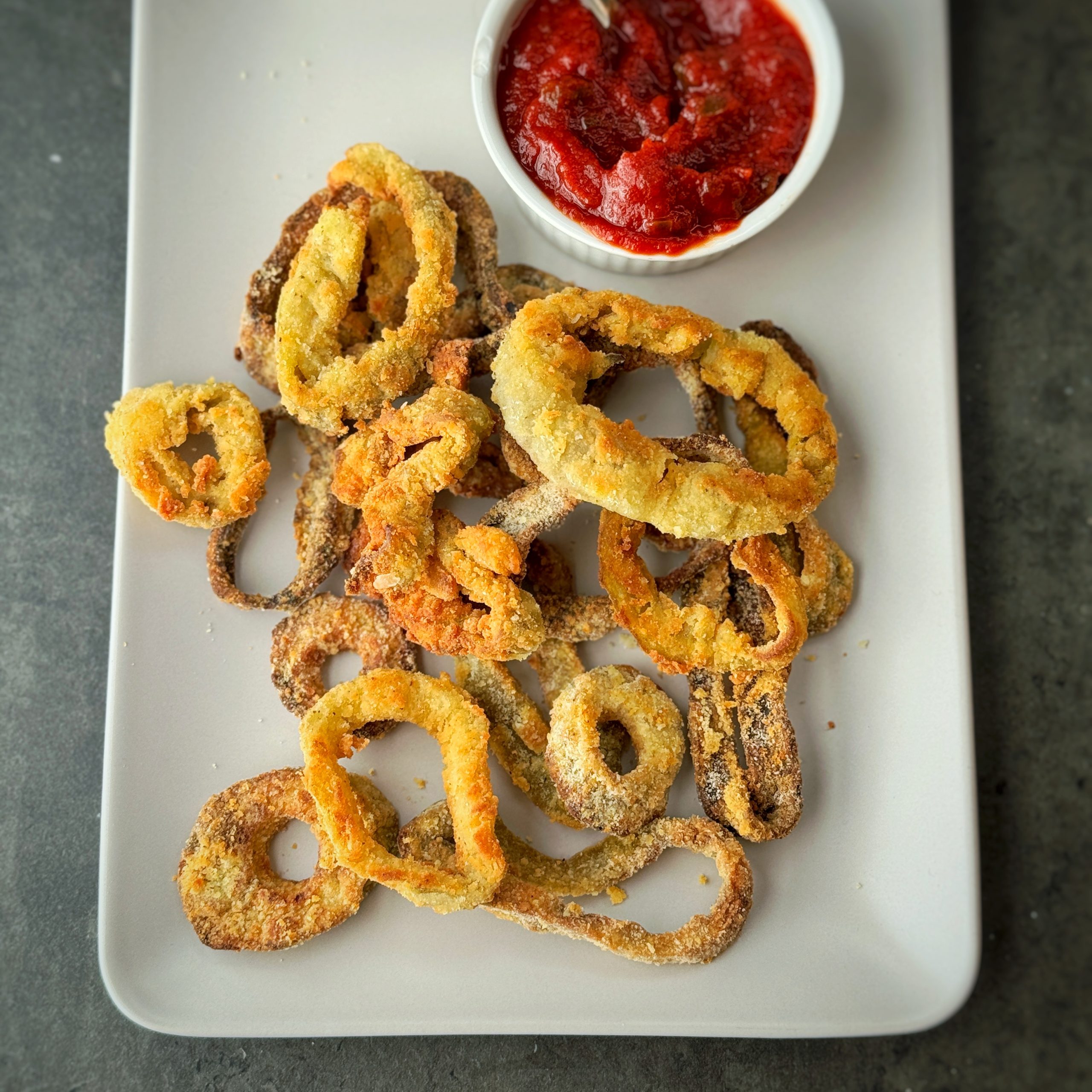 An image of Vegan Calamari with a jalapeno ketchup