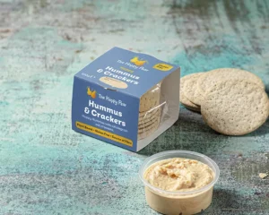 An image of happy hummus and crackers