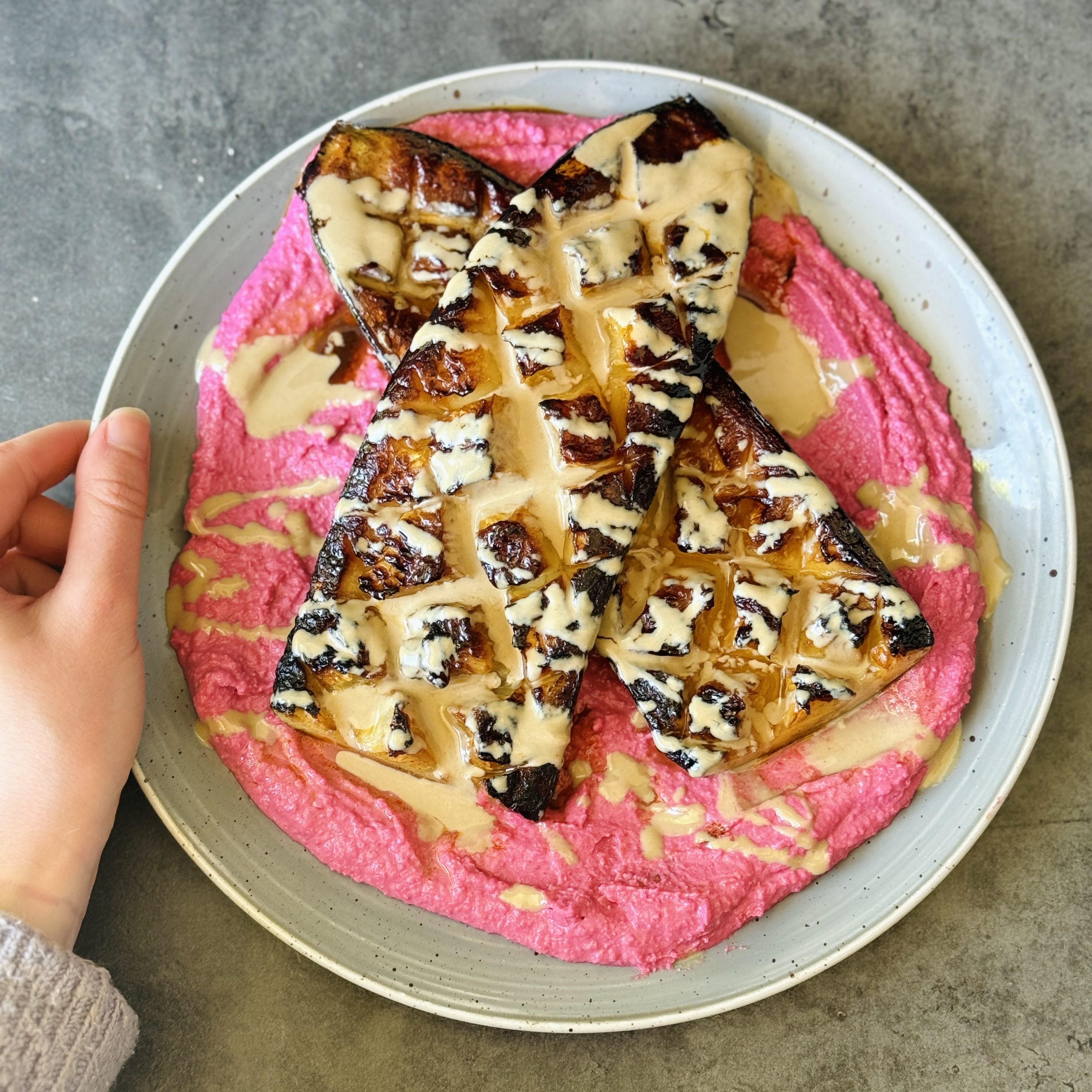 An image of Charred Courgette & Beet Hummus with Tahini Dressing