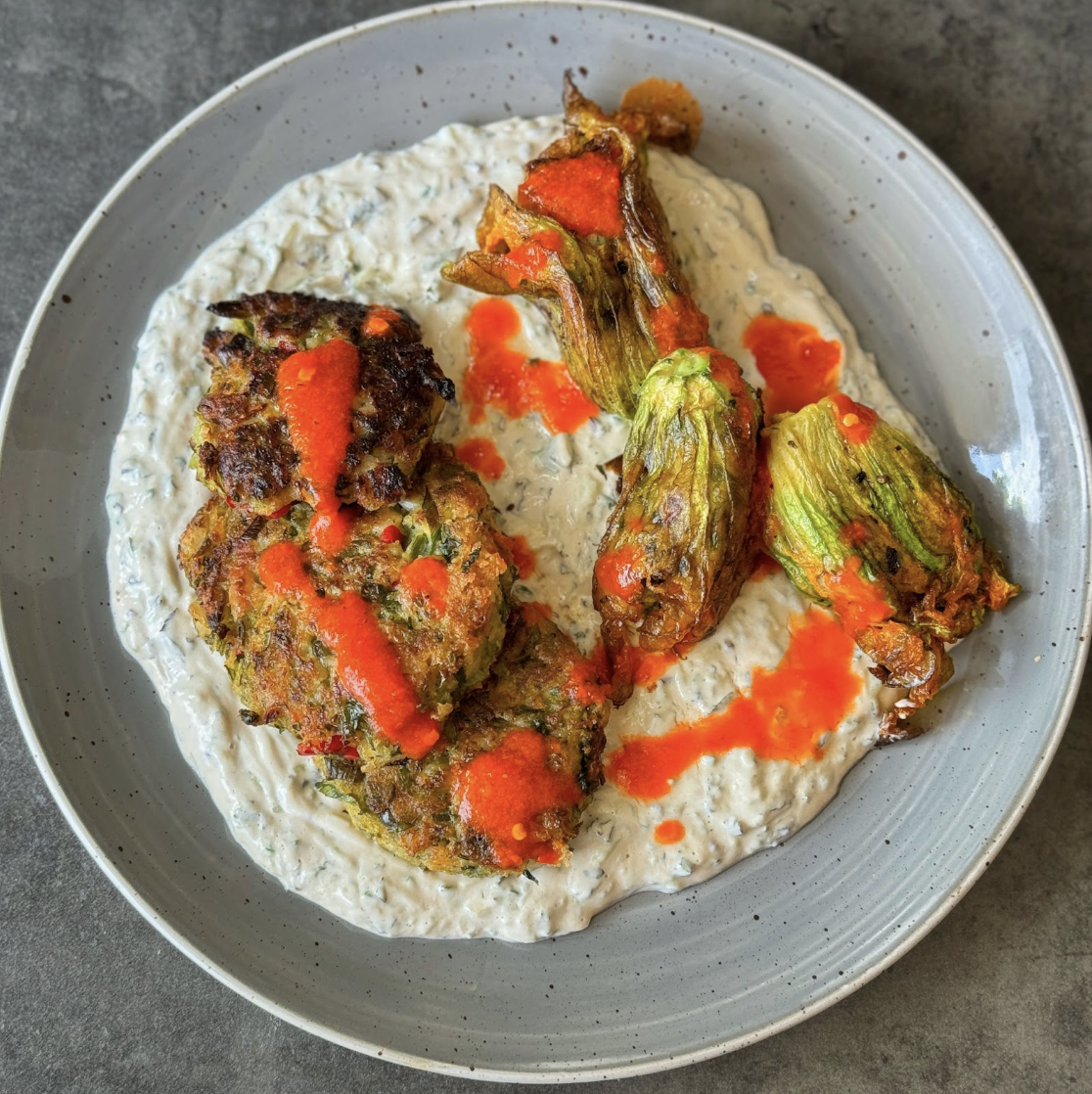 An image of Courgette Fritters with a Tzatziki Tahini Cream and Chilli Sauce