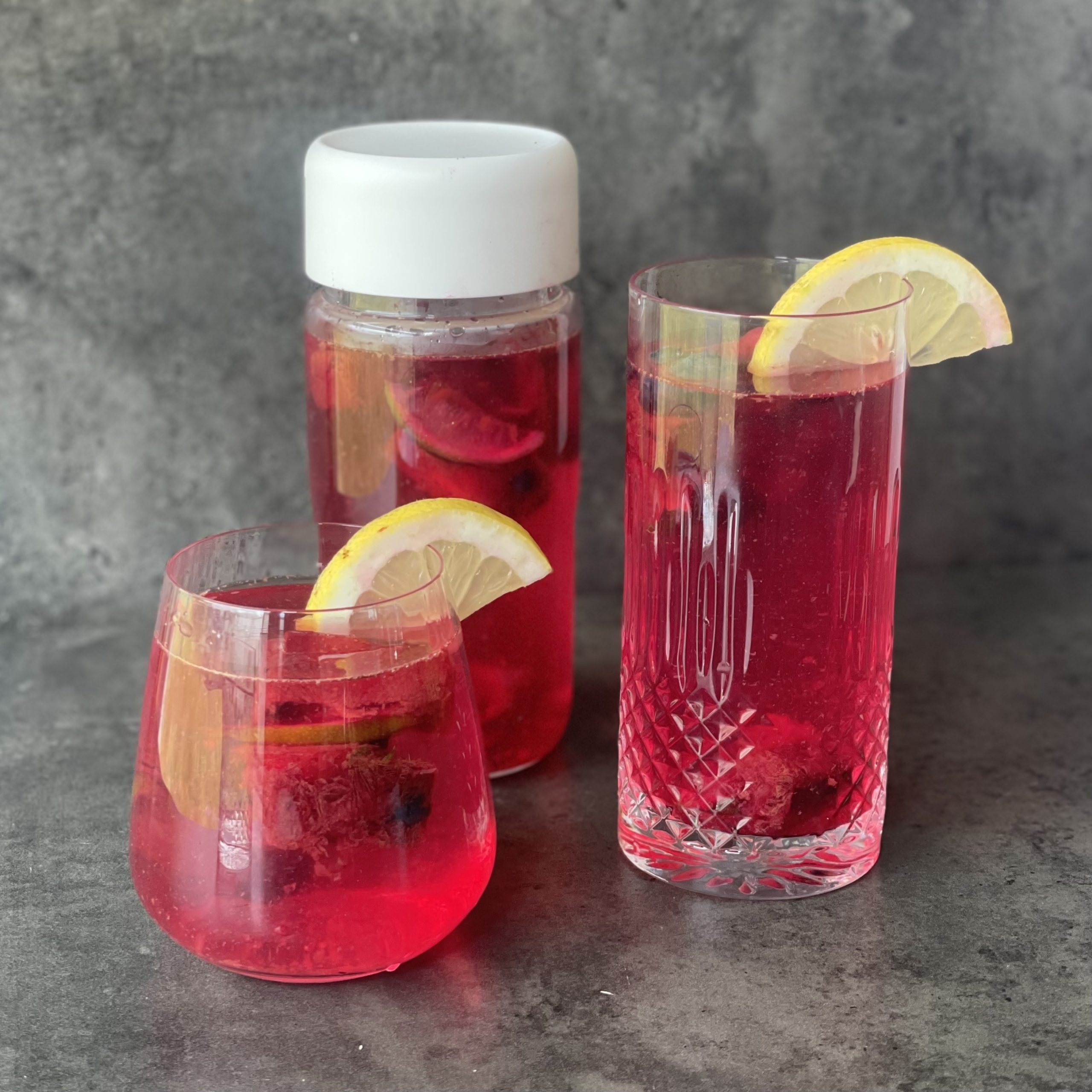 Picture of glasses of water with colourful fruity ice cubes