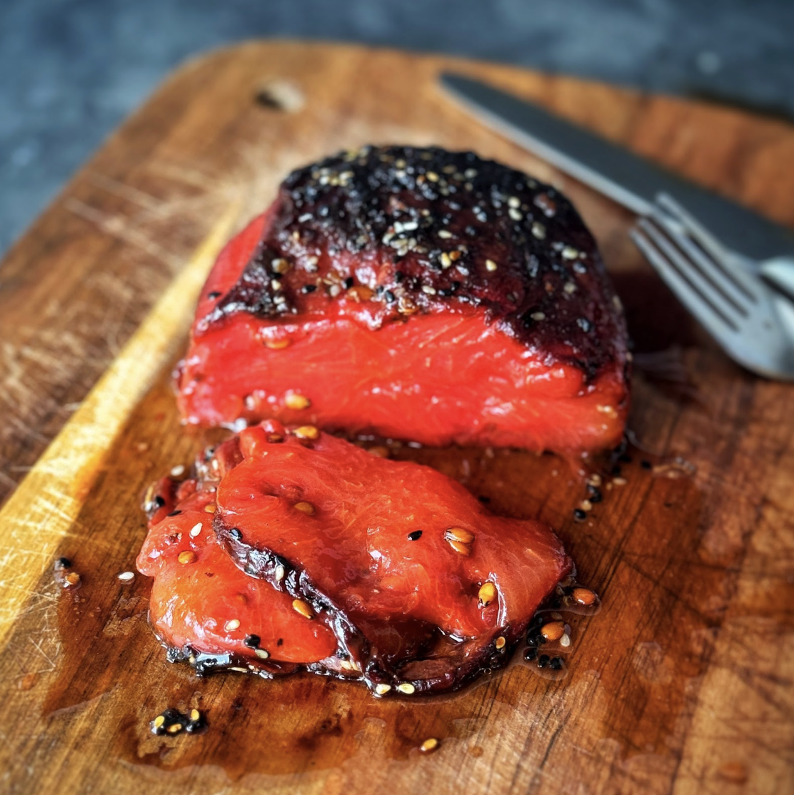 a photo of vegan watermelon tuna steak on wooden board