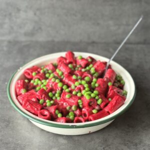 a photo of a bowl of Beetroot Pesto Pasta with Peas