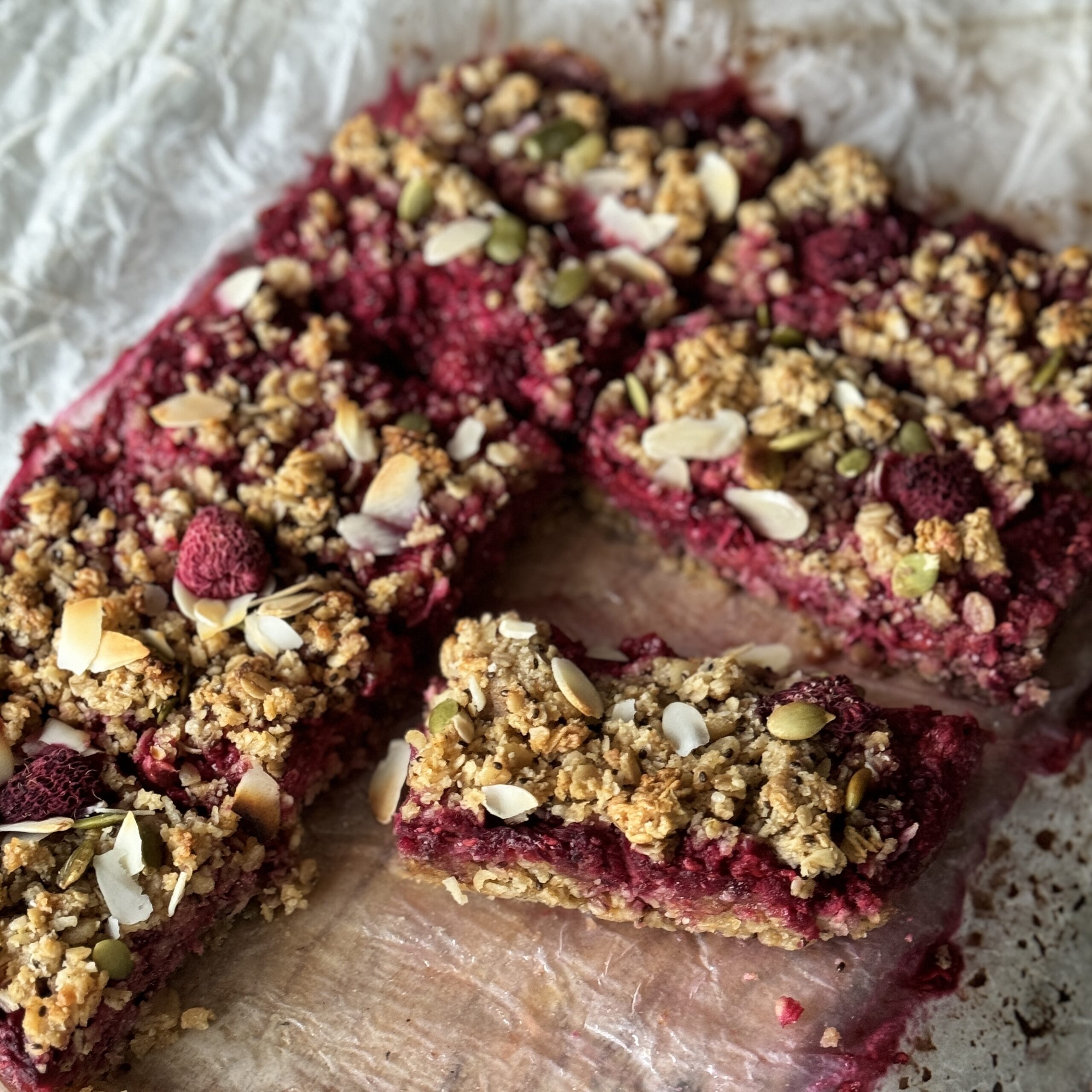 a photo of a tray of Berry crumble breakfast bars