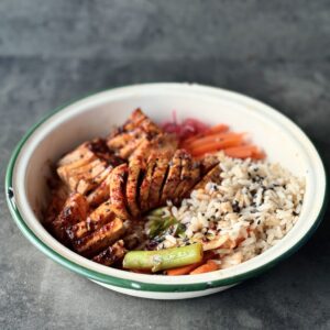 a photo of a bowl of Hassleback Tofu with Miso Glaze with carrots and rice