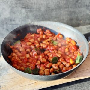 a photo of a pan of High Protein Tofu Gnocchi in tomato sauce