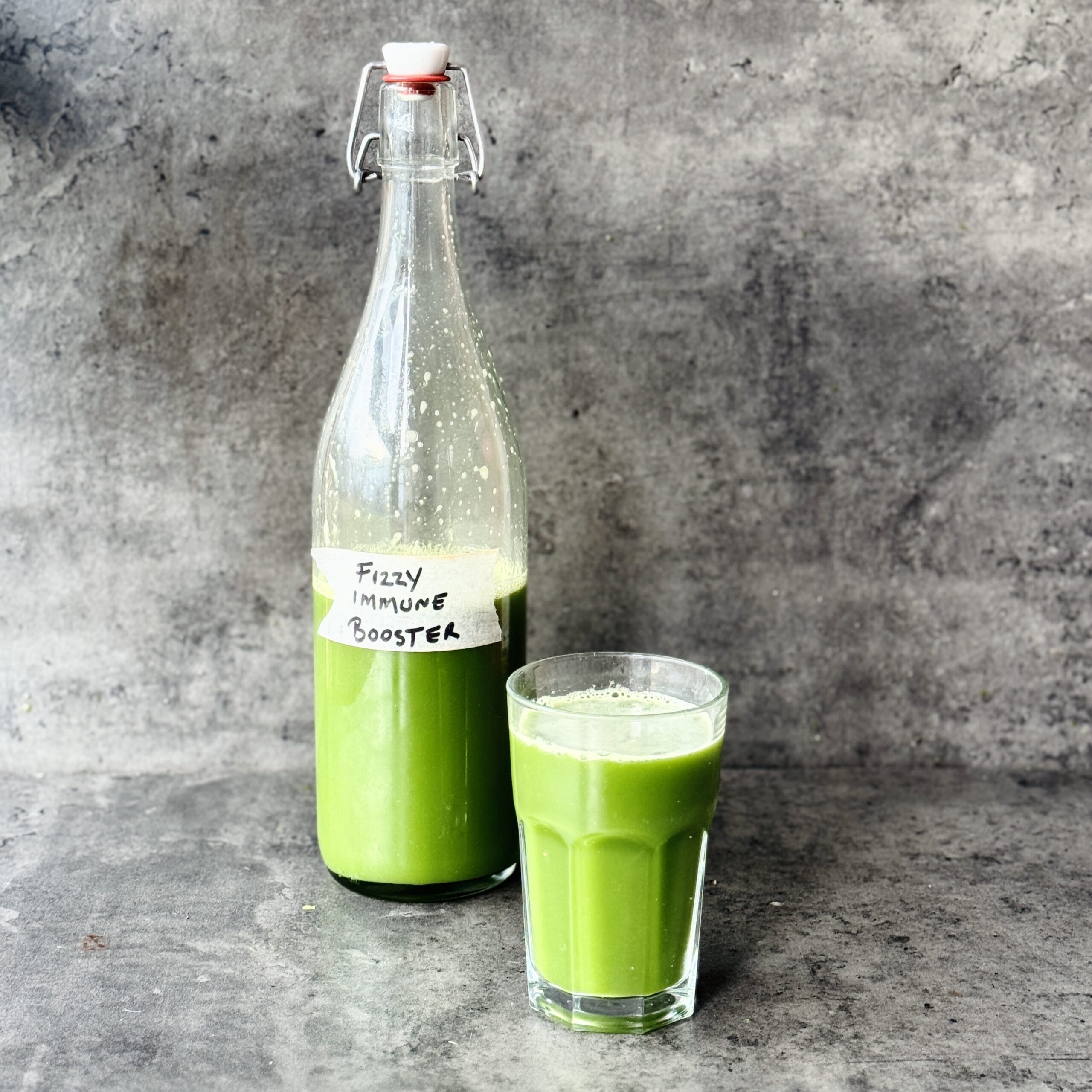 a photo of a bottle and glass of Immunity Booster Fermented Fizz