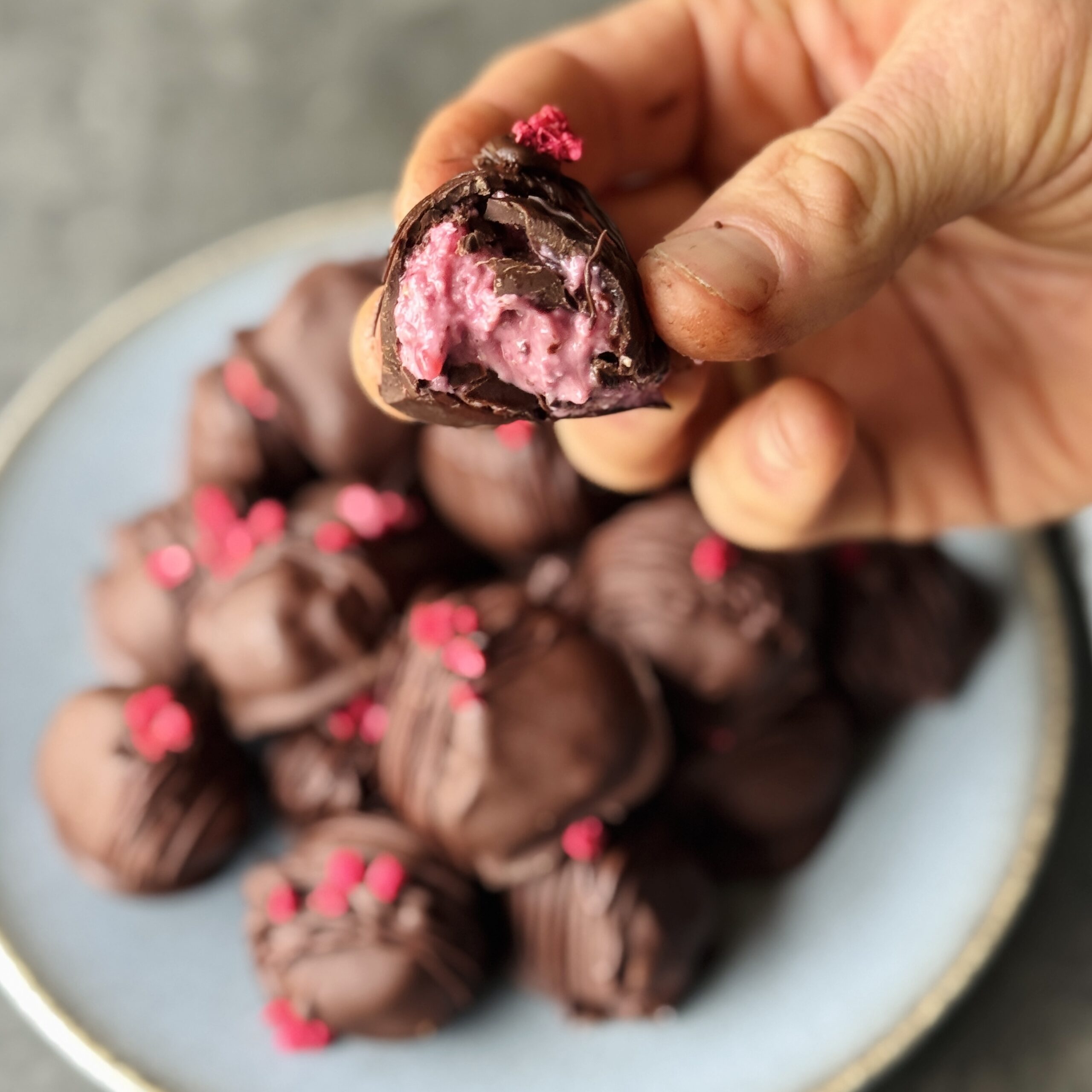 a photo of raspberry love chocolate truffles