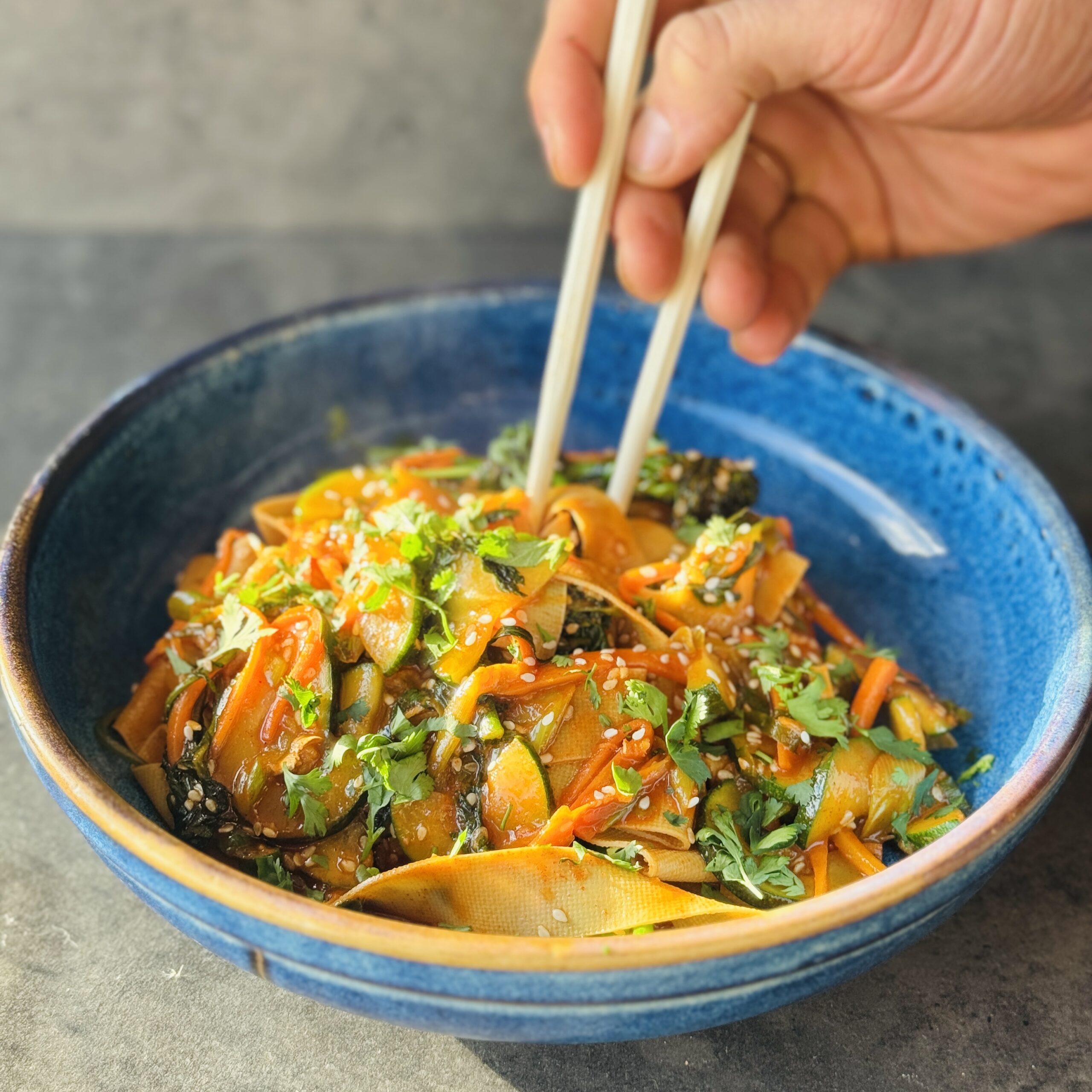 a photo of a bowl of high protein tofu noodles