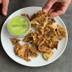 a photo of a plate of High Protein Pesto Crackers with Organic Super Greens Pesto