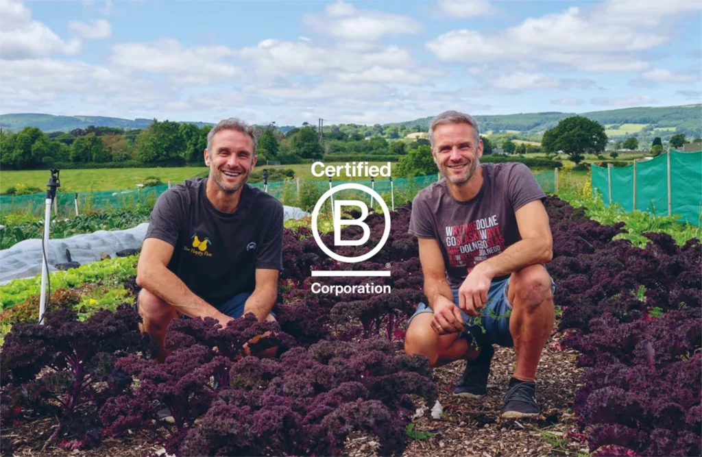 image of david and stephen flynn at their farm with the b-corp logo