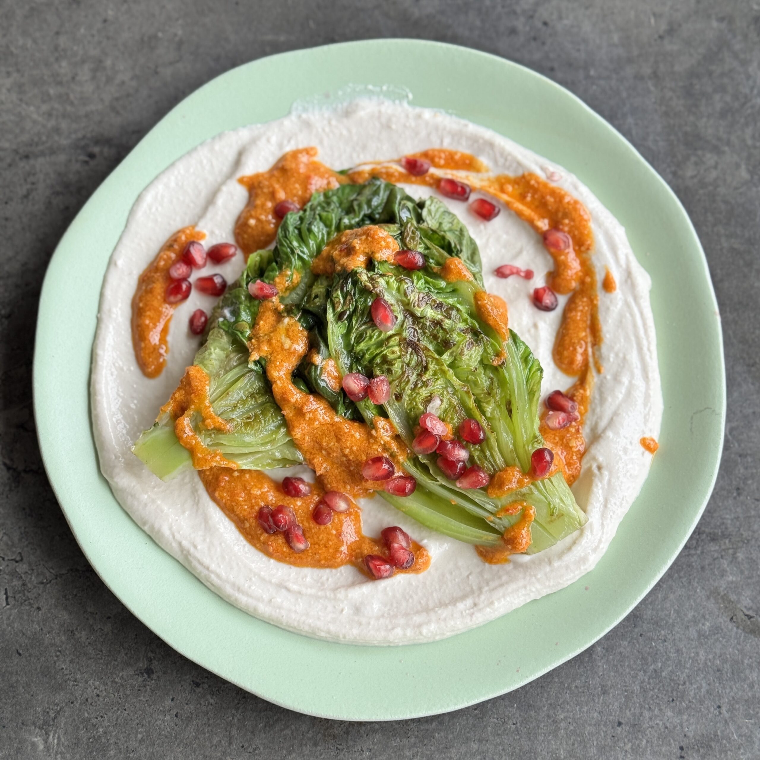a photo of Grilled Lettuce on Tahini Cream