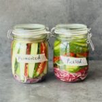 a photo of 2 jars of Cucumbers 2 Ways : Pickled & Fermented