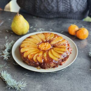 a photo of Sticky Upside-Down Gingerbread Cake with Pear, Pecan & Pastry