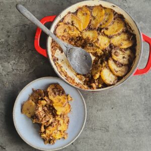 a photo of Plant-Based Shepherd’s Pie with Gratin Potato & Sun-Dried Tomato Pesto