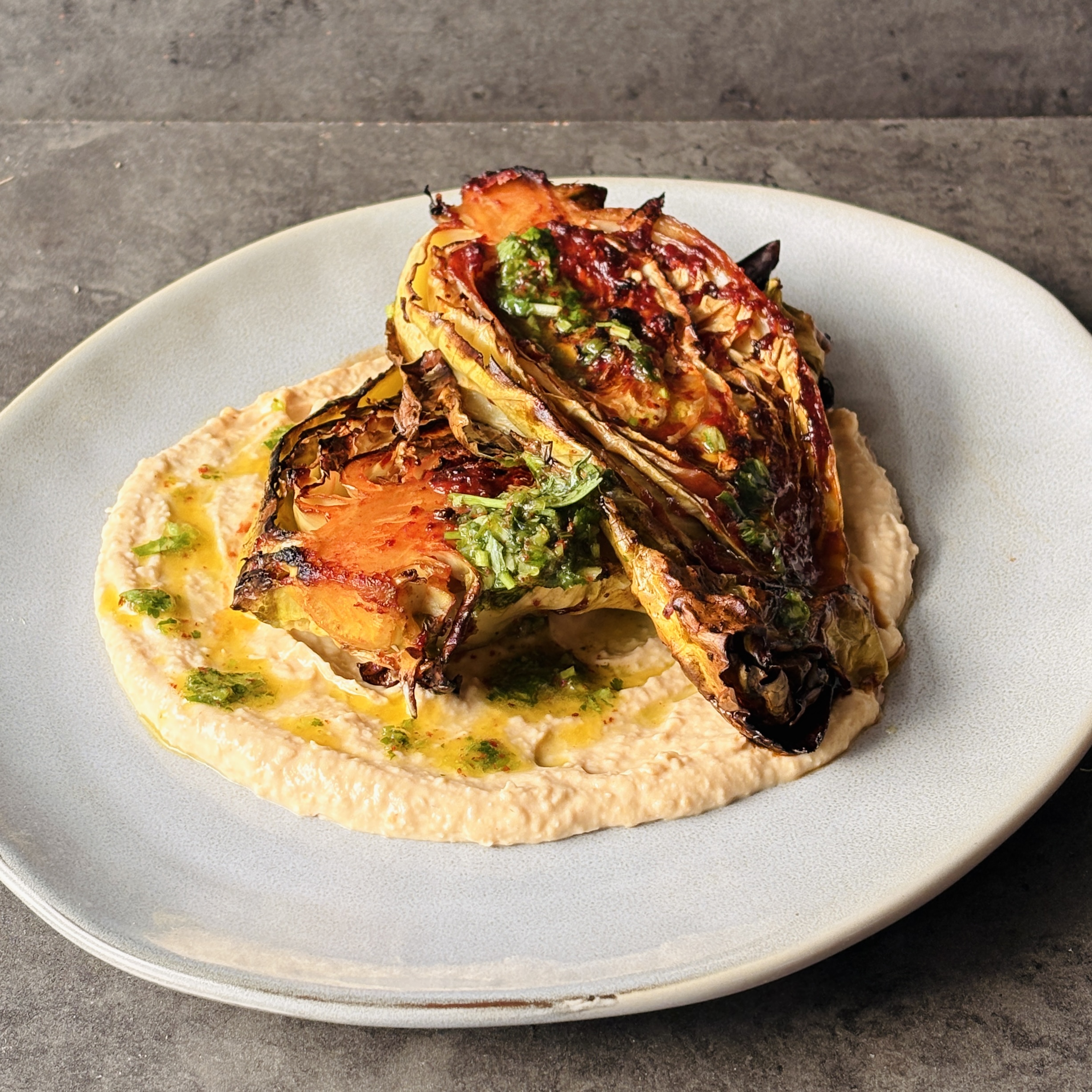 a photo of Charred Gochujang Cabbage with Herb Vinaigrette