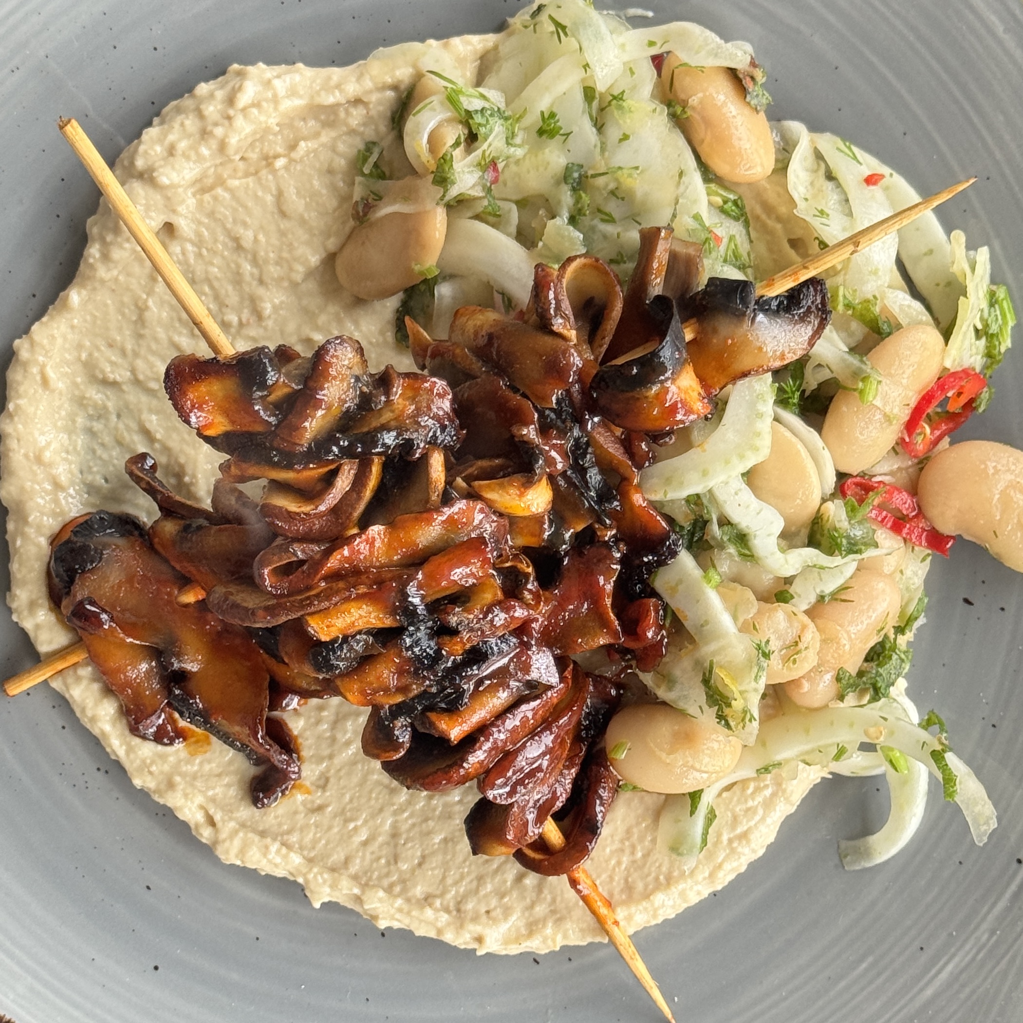 a photo of Gochujang Glazed Mushroom Skewers with Fennel Bean Salad