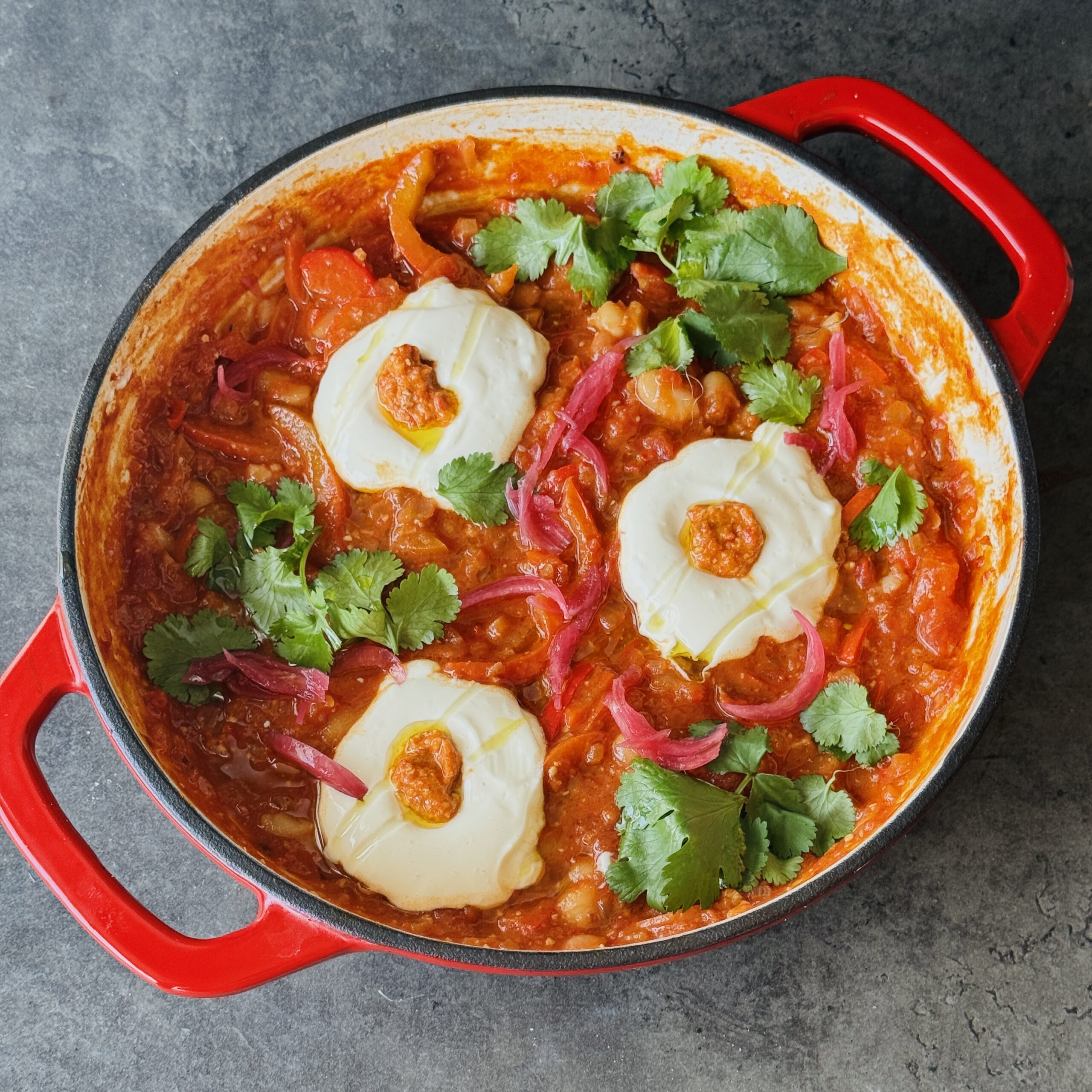 a photo of High-Protein Red Pepper Pesto Shakshuka with Whipped Tofu Eggs