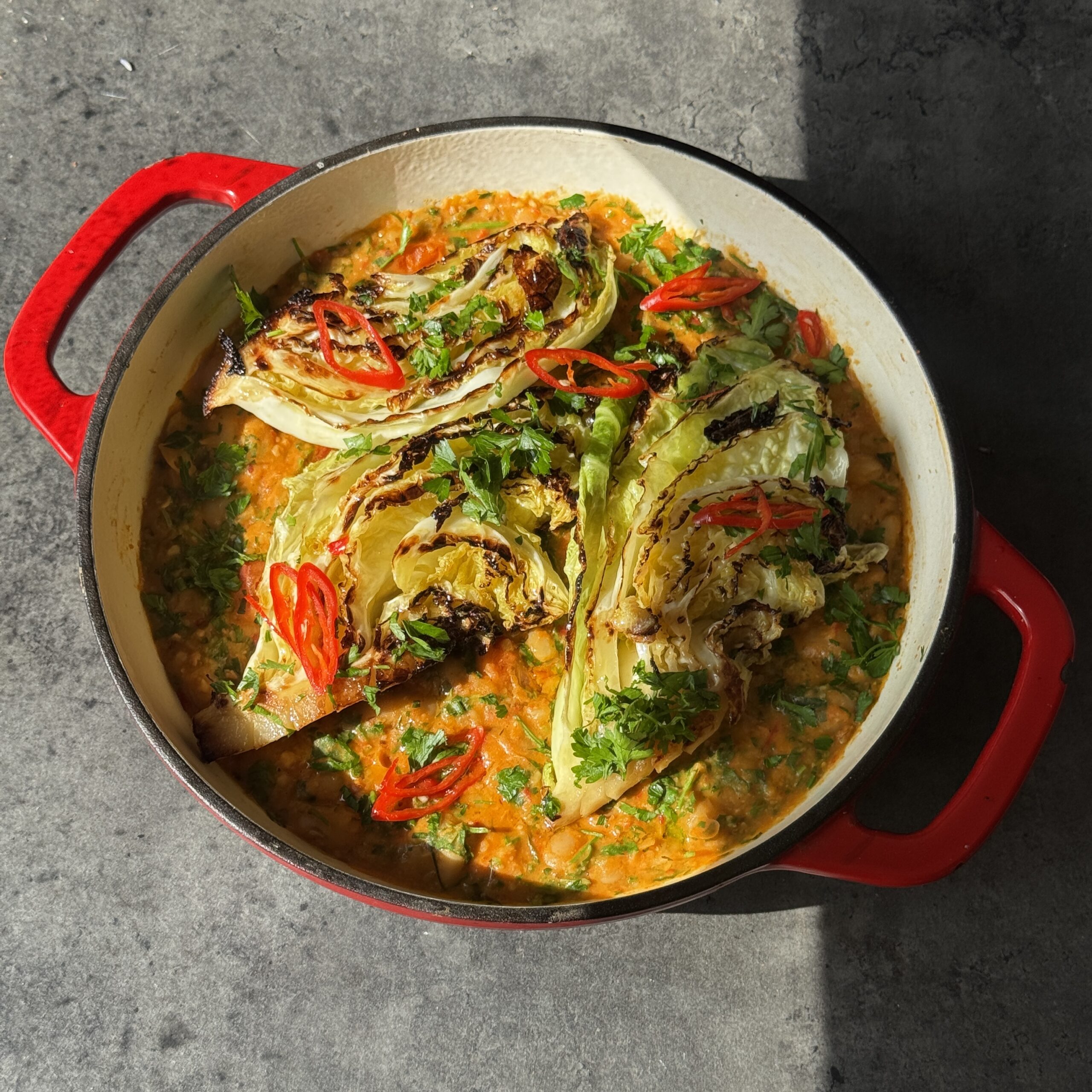 a photo of 15-Minute Charred Cabbage with Spicy Red Pepper Butter Beans